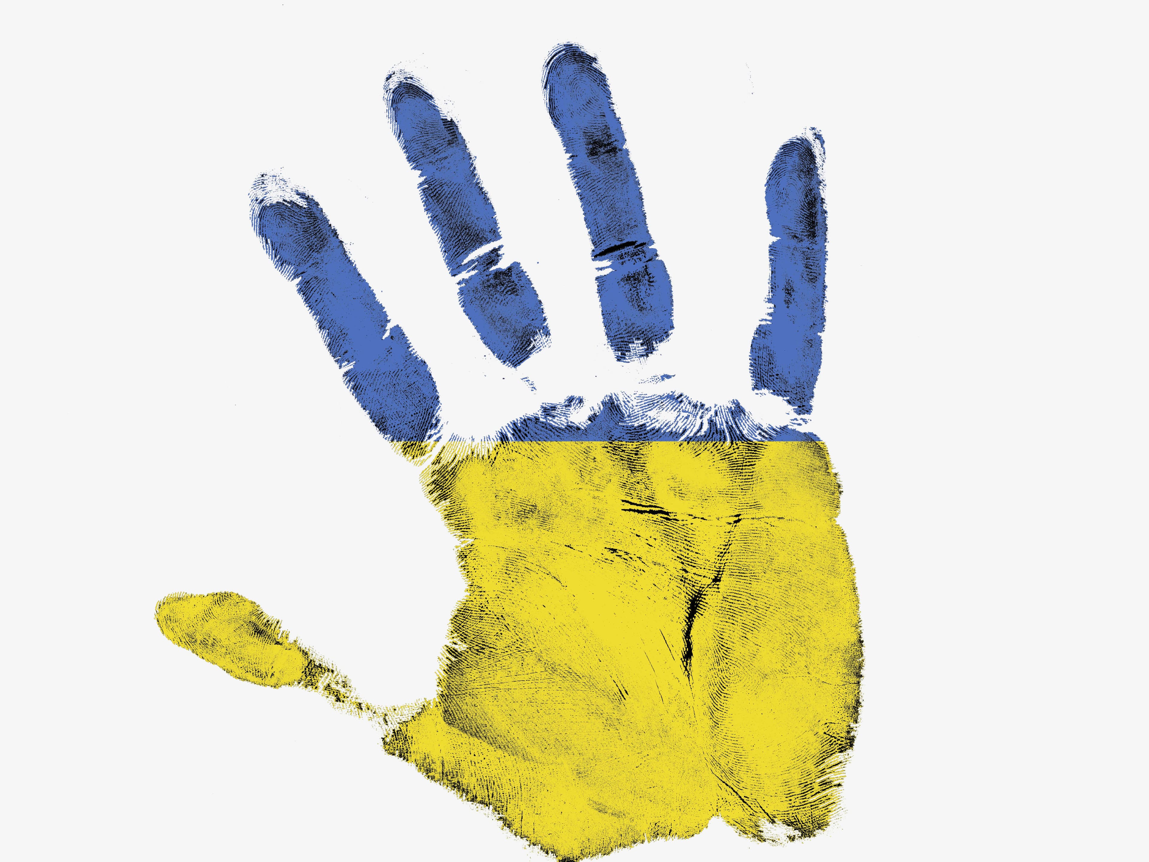 A hand painted in the colors of the Ukrainian flag